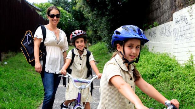 "So many people drive their kids to school and double park outside. There's near accidents all the time," says parent Mimi Kilka with Talia and Ariella.