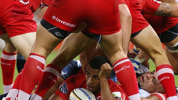 Rare respite . . . Will Genia of the Reds at the bottom of a ruck.