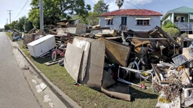 Not quite your average council clean-up ... in the low-lying Brisbane suburb of Rocklea residents turned their homes inside out.