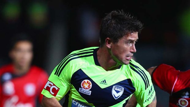 Looking up: Victory's Harry Kewell controls the ball during last night's game.