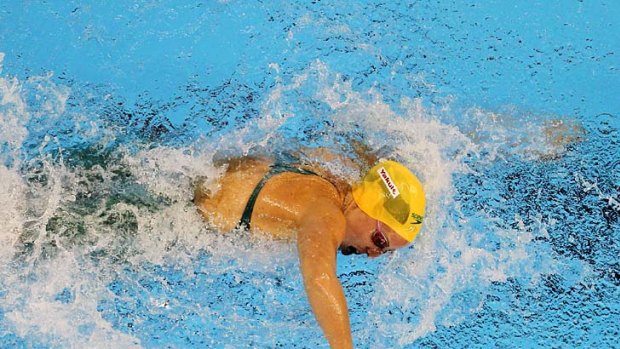Alicia Coutts of Australia competes in the heats of the 100 metres freestyle.