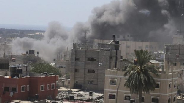 Smoke rises following what witnesses said was an Israeli air strike on a house in Rafah in the southern Gaza Strip.