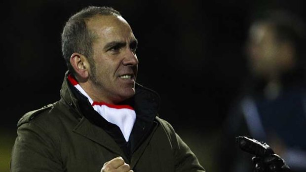 Swindon Town manager Paolo Di Canio celebrates his side's victory over Wigan Athletic in their third-round FA Cup clash.
