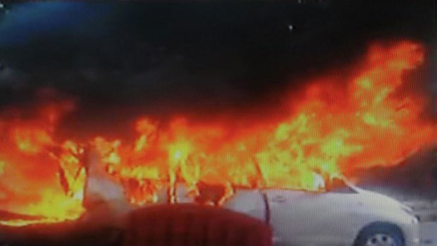 The burning wreckage of an Israeli embassy car following an explosion in New Delhi.