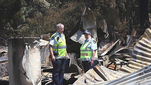 Chief Commissioner Christine Nixon (left) tours Kinglake after the devastating fires with Inspector Ross Smith.