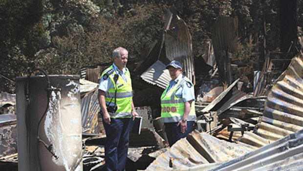 Chief Commissioner Christine Nixon (left) tours Kinglake after the devastating fires with Inspector Ross Smith.