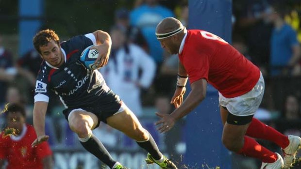 Rebel fighter ... Danny Cipriani, the Melbourne Rebels' English import, runs with ball in a trial match against Tonga.