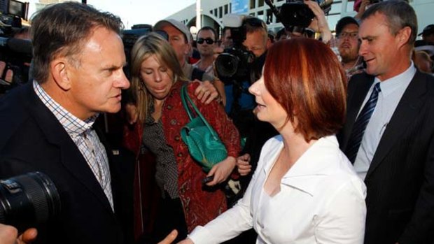 Mark Latham confronts Julia Gillard in Brisbane on Saturday.
