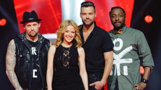 Growing rivalry ... coaches Joel Madden and Kylie Minogue (from left) fought hard to add singers to their teams as Ricky Martin and will.i.am danced along this week.