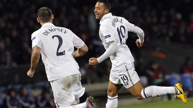 Mousa Dembele (right) celebrates with Clint Dempsey,  after he scored against Tottenham during their Europa League round of 32 soccer match in Lyon.