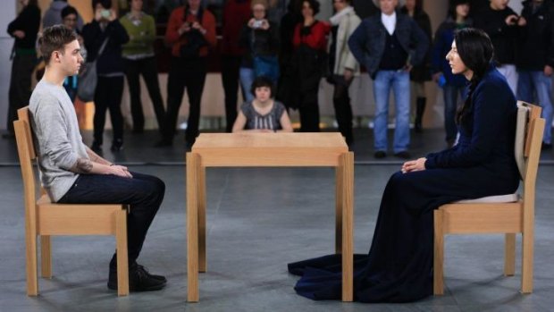 Awkward: Marina Abramovic, right, and a visitor to the Museum of Modern art perform <i>The Artist is Present</i> in 2010 in New York.