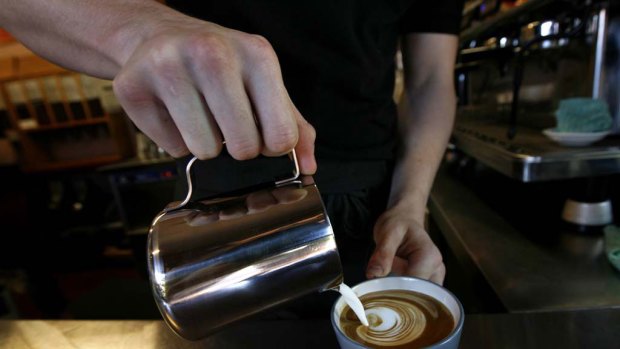 Flat white ... barista Sean Williams from Forsyth Coffee and Tea makes another coffee. The Sydney cafe will not use cheap milk because it does not froth.