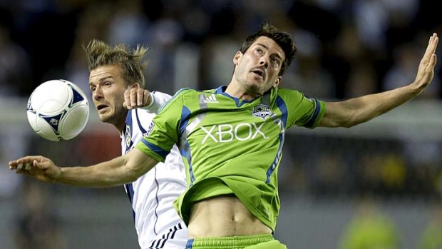 Superstar in action: David Beckham contends for the ball last weekend against Seattle Sounders defender Brad Evans.