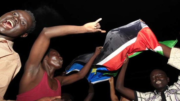 South Sudanese dance in the streets of Juba early yesterday to celebrate their independence.