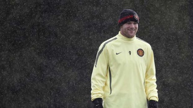 Manchester United's Wayne Rooney smiles during training.