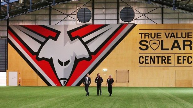 James Hird being shown the facilities by chief executive Xavier Campbell (left) and football manager Neil Craig when he returned to work at the club on Monday.