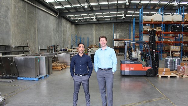 Robert Dalessandro and Adam Laurie in the Cleanawater factory.