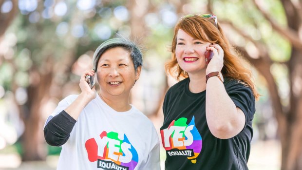Volunteers Anita Tang and Rebecca Wilson hosted one of hundreds of "yes" campaign calling parties around the nation on Sunday at Prince Alfred Park in Sydney. 