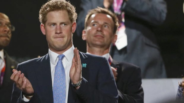 All alone ... Prince Harry at the closing ceremony of the Olympics.