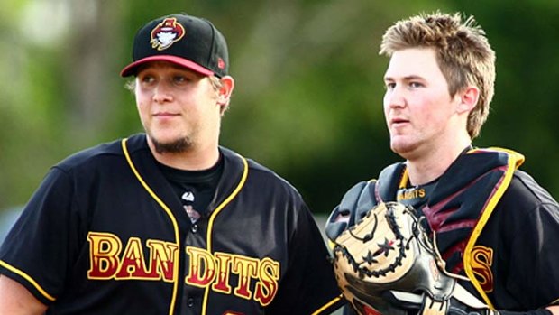 Bandits pitcher Ryan Seale and catcher Mitch Nilsson confer on the mound last season.