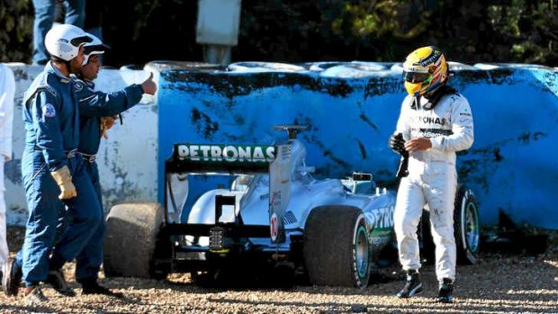 Gravel dash ... Lewis Hamilton walks away from his Mercedes after crashing into the gravel.