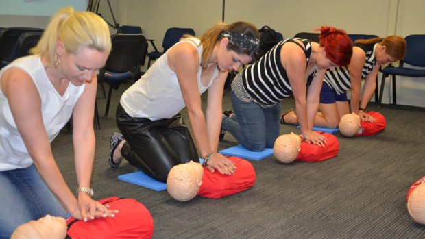 Media mums Amy Zempilas, Jessica Bratich-Johnson, Trae Flett and Elissa practise giving first aid.