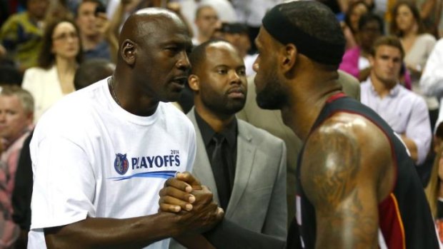 Charlotte Bobcats owner Michael Jordan congratulates LeBron James after the Miami Heat swept into the second round of the NBA playoffs.