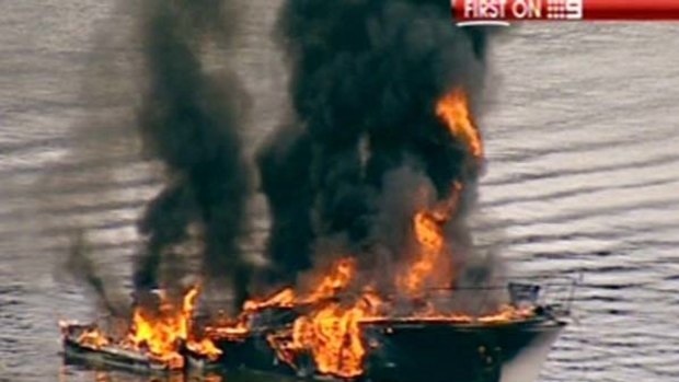 Up in flames ... the cabin cruiser on fire.