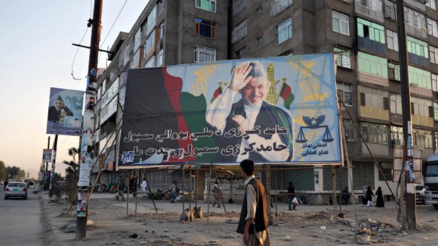 Clear lead ... Afghanistan's President Hamid Karzai on a billboard in Kabul.