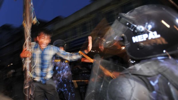 Riot police clash with protesters who fear a federal system.