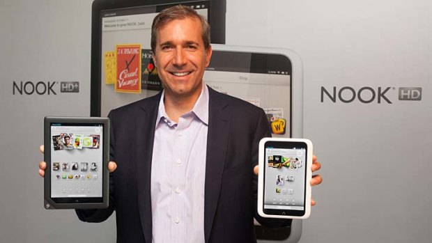 Barnes & Noble CEO William Lynch shows off the Nook HD+, left, and the Nook HD.