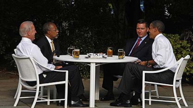 Not everyone's on the beer ... President Barack Obama with Harvard scholar Henry Louis Gates, police sergeant James Crowley and Vice-President Joe Biden.