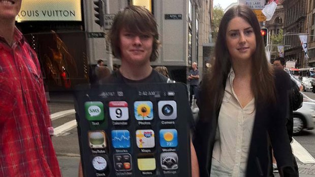 Activists in Sydney deliver the 250,000-strong petition to the Apple store this morning.