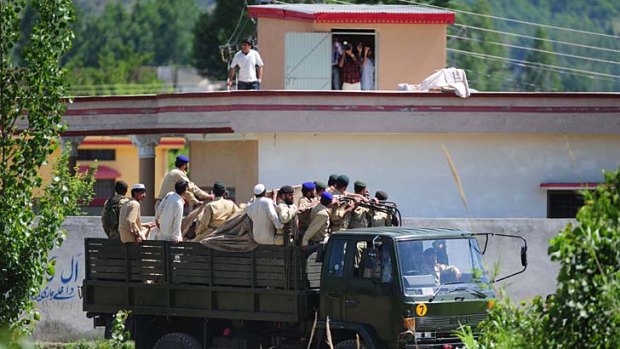 Pakistani soldiers leave the area near bin Laden's hideout.