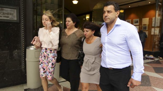 Unhappy: Former NRL player Joe Thomas, the son of Mary Touma who died when she was pushed over, with other family members outside the court on Friday.