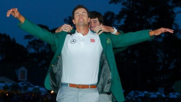 'I want to stamp my foot down as a big-time player': Bubba Watson gives Scott the green jacket at the 2013 Masters.
