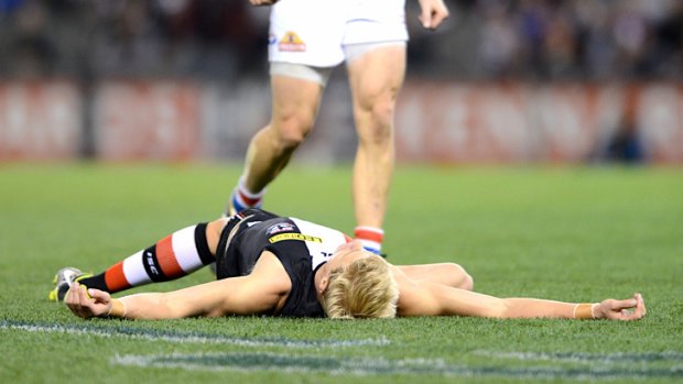 St Kilda's Nick Riewoldt hits the deck, concussed, in May.