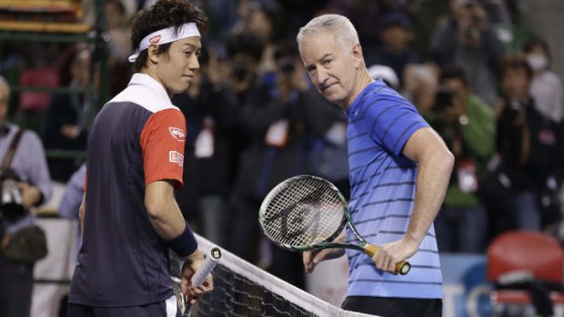 World No.17 Kei Nishikori (left) with former champion John McEnroe.