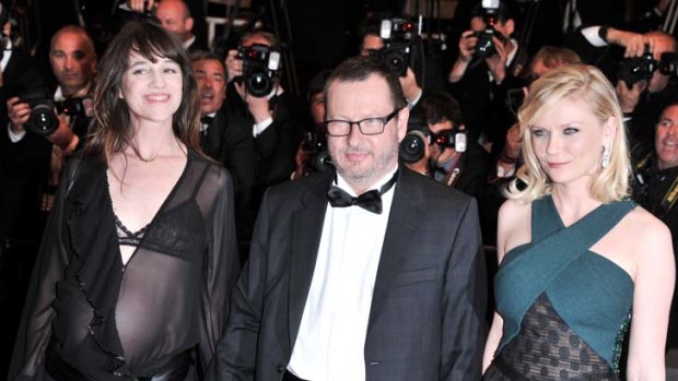 Lars von Trier with Charlotte Gainsbourg and Kirsten Dunst at the <i>Melancholia</i> premiere.
