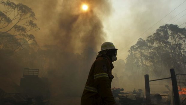 Firefighters protecting properties at Lithgow during the October bushfires.