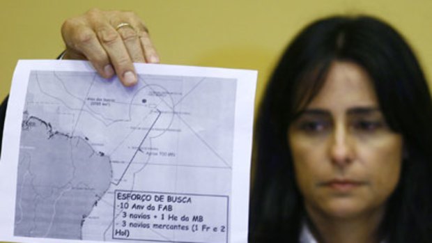 The Brazilian Defense Minister holds a diagram of the crash area of Air France flight AF447 during a news conference.