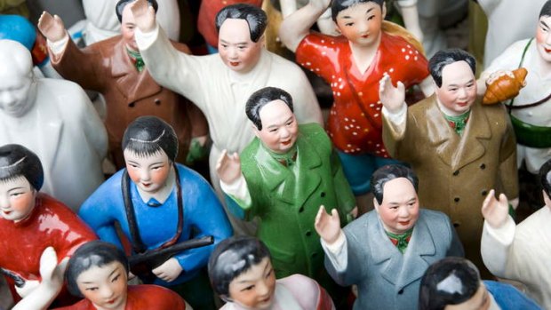 Chairman Mao and other Cultural Revolution ceramic figures on a stall at Dongtai Road Antiques Market, Shanghai.