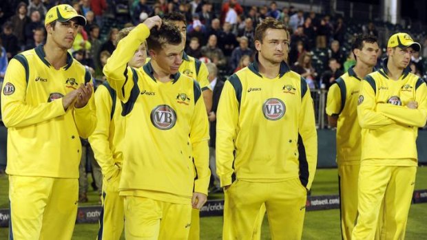 Glum: Mitchell Johnson, Xavier Doherty and Peter Forrest after losing the final ODI.