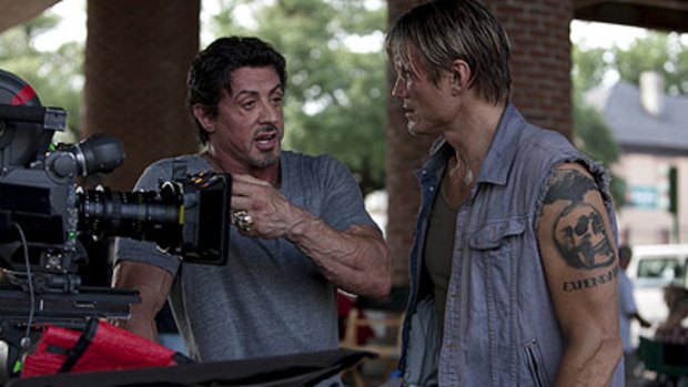 Dolph Lundgren chats to Sylvester Stallone on the set of The Expendables.