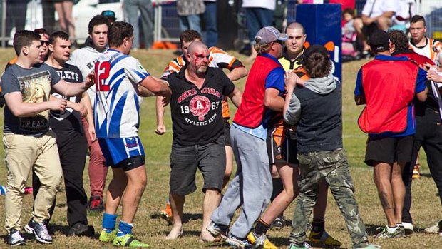Players and spectators involved in a brawl at Turnbull Oval.