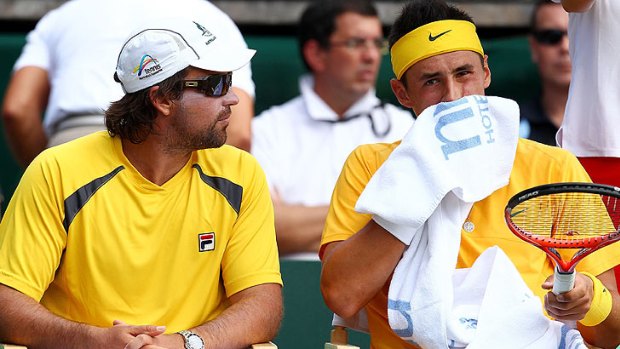 'More discipline': Team captain Pat Rafter talks with Bernard Tomic during a break at the Davis Cup.