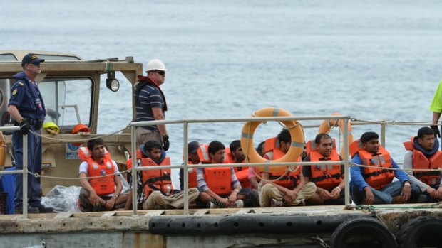 A boat load of asylum seekers arrive on Christmas Island.