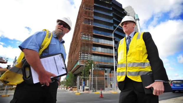 Workplace safety officers Alan Chipperfield and Mark McCabe are part of a team of officers that made a suprise visit to the Nishi building site in Canberra today.