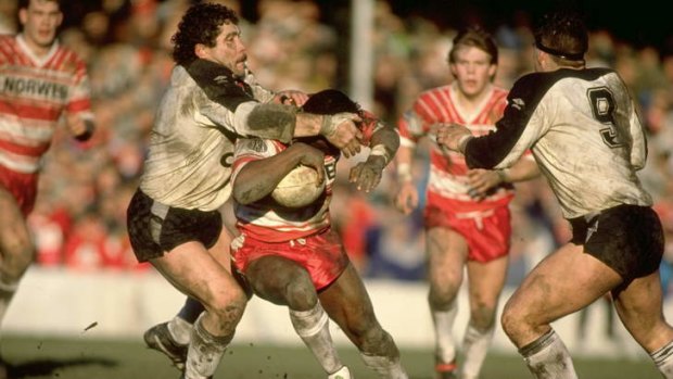 Iconic player: Ellery Hanley is tackled by Kurt Sorenson of Widnes during a Stones Championship match at Naughton Park in Widnes on February 3, 1990.