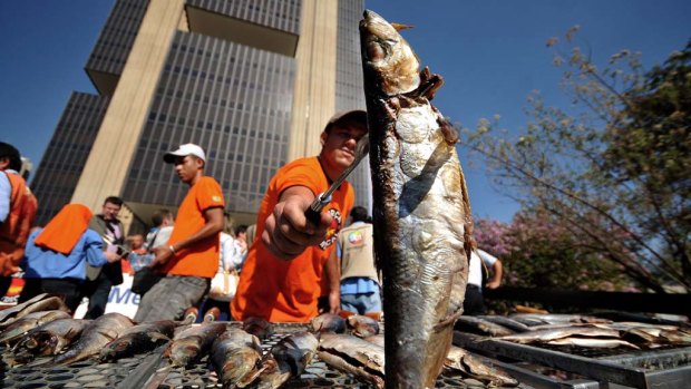 Something fishy ... Brazilian unionists demand lower interest rates during a demonstration.